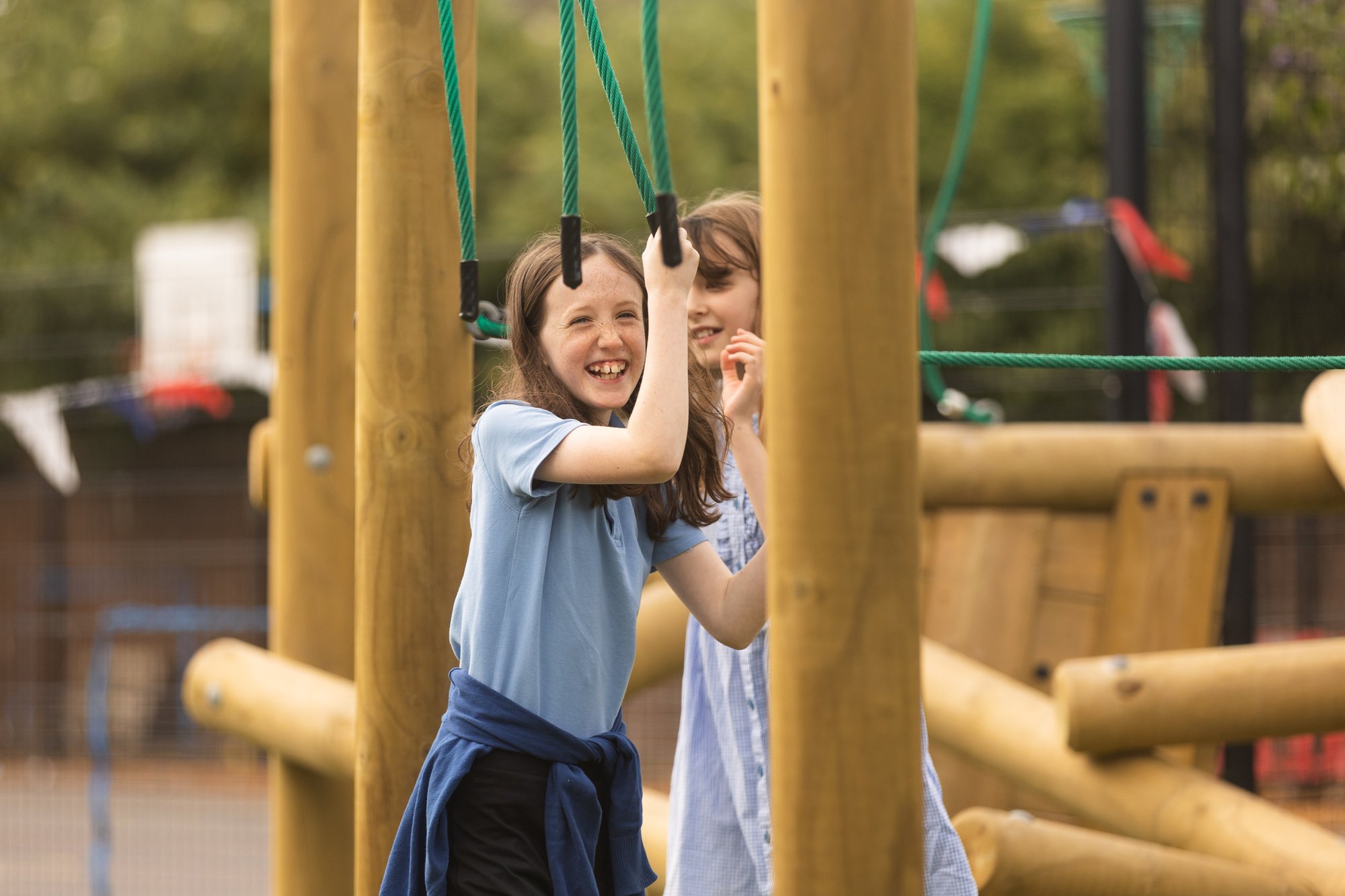 DBDplay at Ashton Gate Primary School. Girls in blue dresses on trim trail